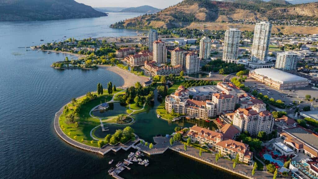 An overview photo of Kelowna's skyline and downtown waterfront park along Okanagan lake