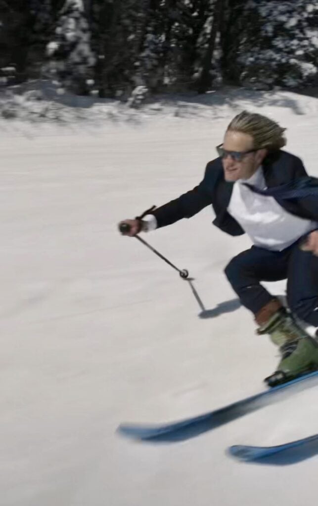 Jaxon Jurome Skiing in a suit and Selling Real Estate at Big White Ski Resort in the Okanagan Valley British Columbia