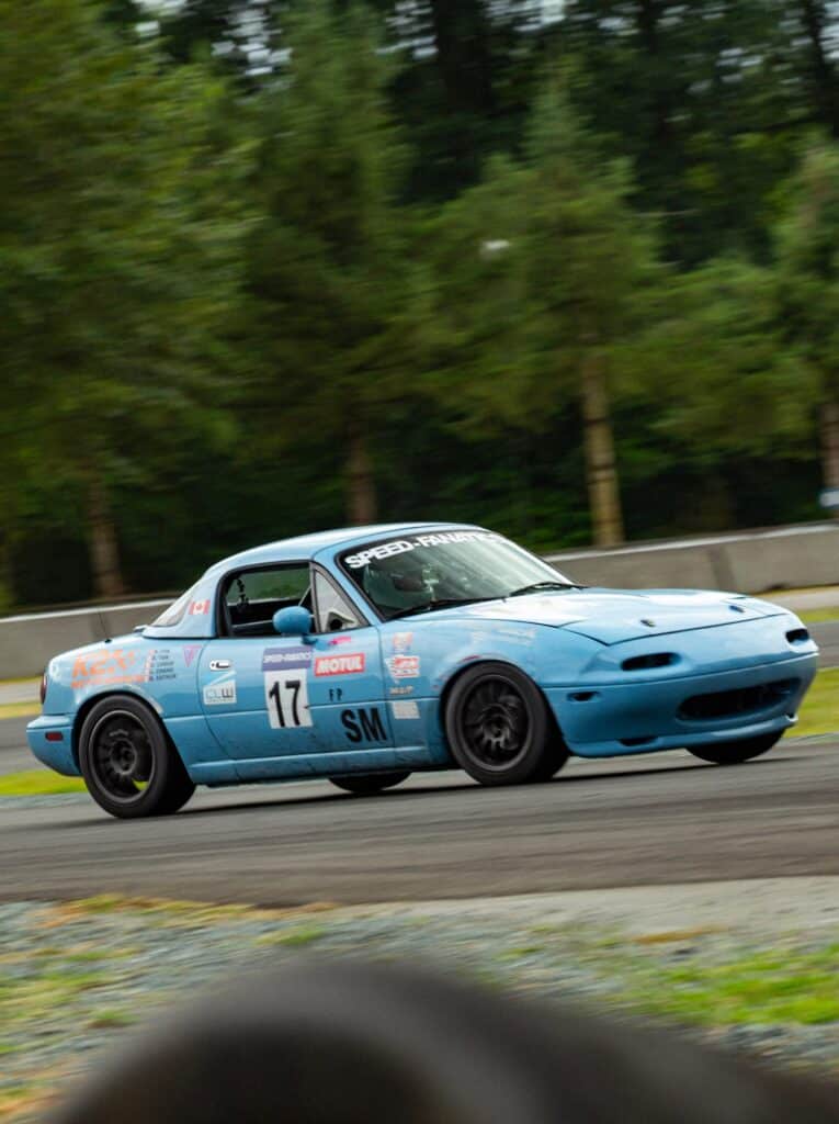 Kelowna Realtor Gloria Romain at the race track racing sportscars in the Okanagan